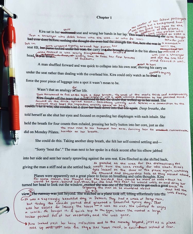 A page of a manuscript marked in red with edits. 